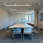 Bayview room with tables located on the 5th floor of Eshleman Hall