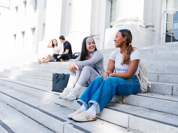 231101UCB078 ub students sitting on the stairs on lower sproul