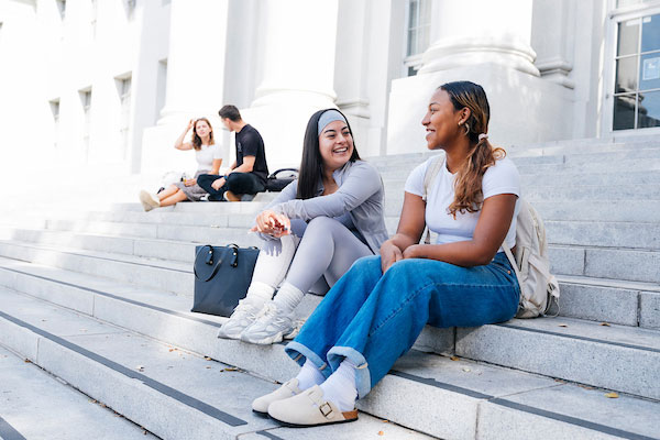 ub students sitting on the stairs on upper sproul